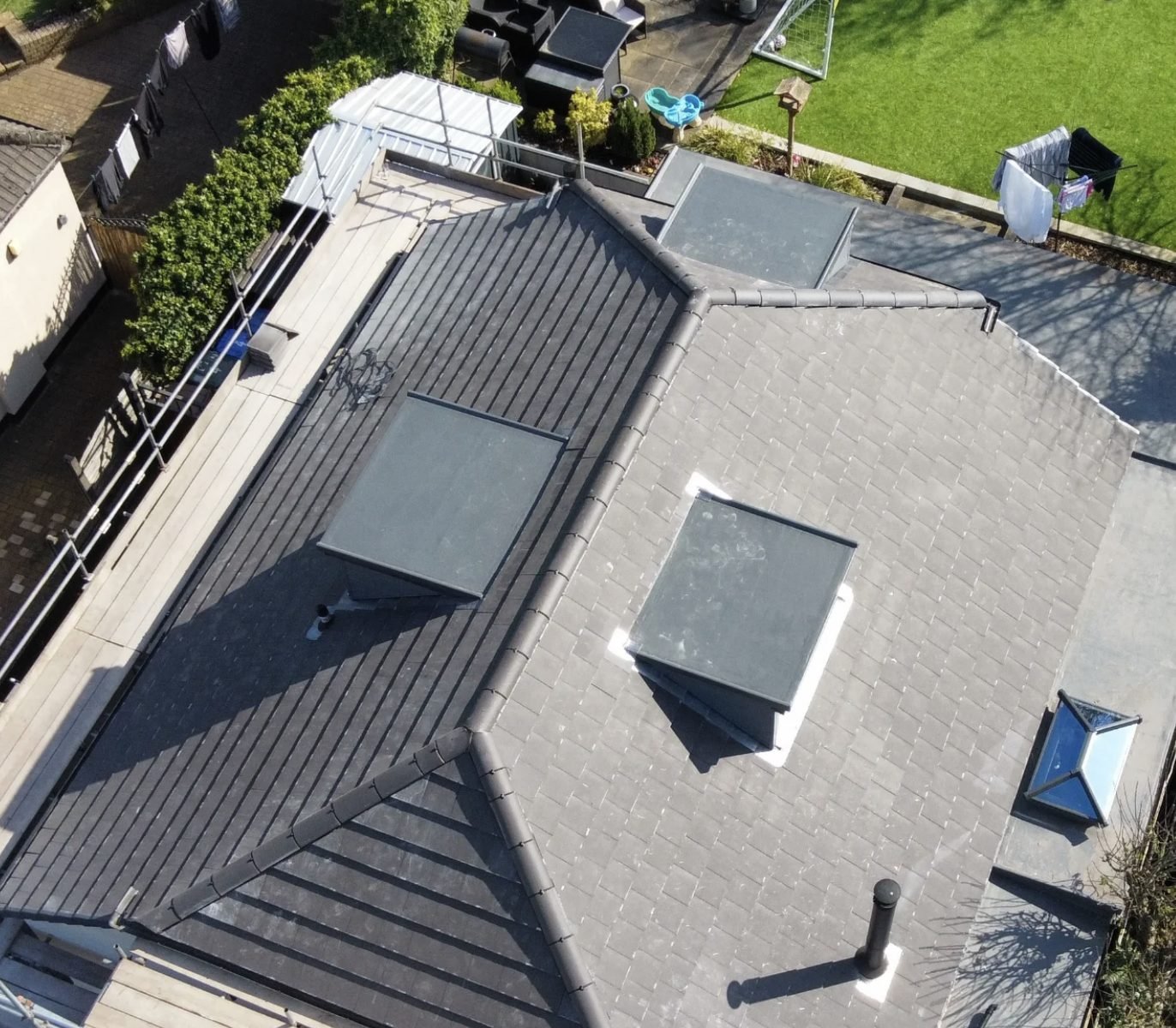 Aerial view of a finished tiled roof with dormers and rooflights